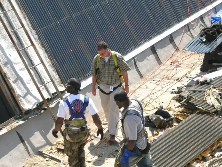 Commercial skylight replacement in Mobile, AL – ARC Roofing crew setting new skylight panels
