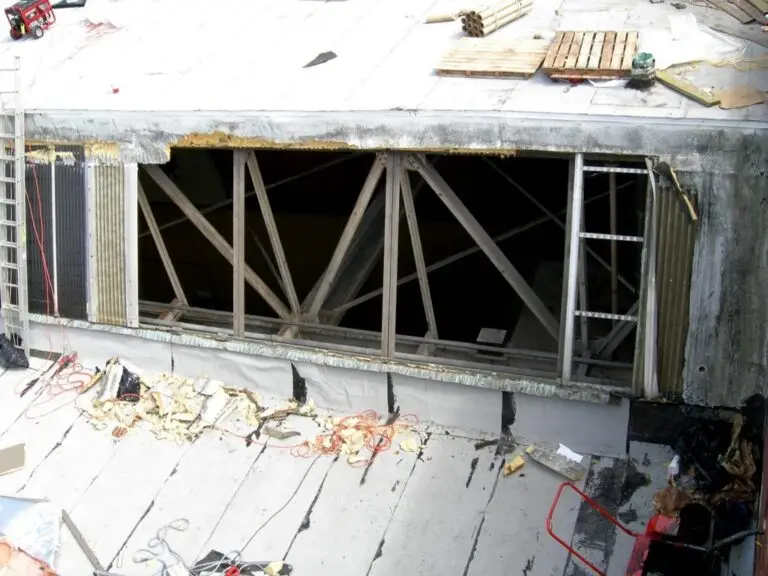 Commercial skylight replacement in Mobile, AL – old skylight panels removed and framing exposed