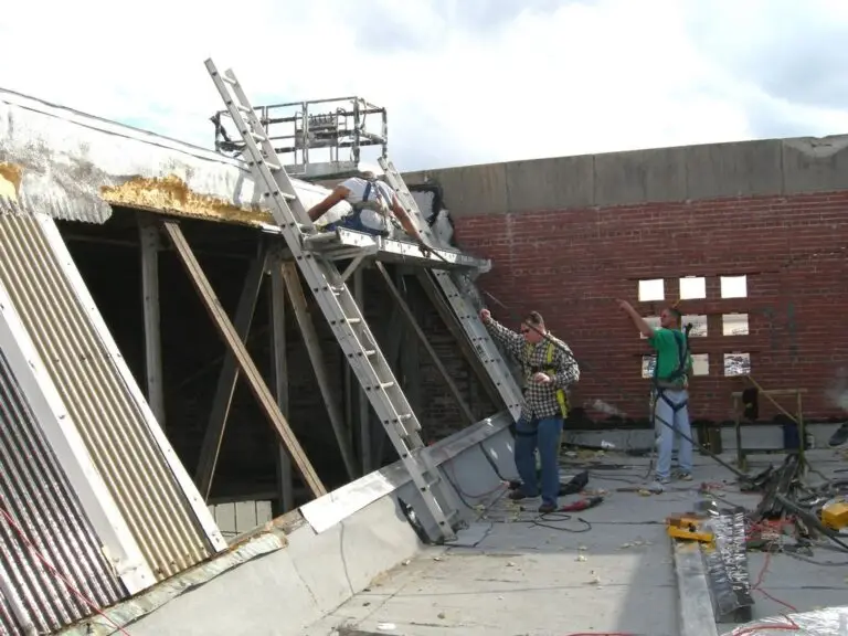 Commercial skylight replacement in Mobile, AL – ARC Roofing crew removing old skylight panels