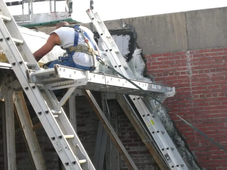 Commercial skylight replacement in Mobile, AL – ARC Roofing crew working on ladders at the skylight