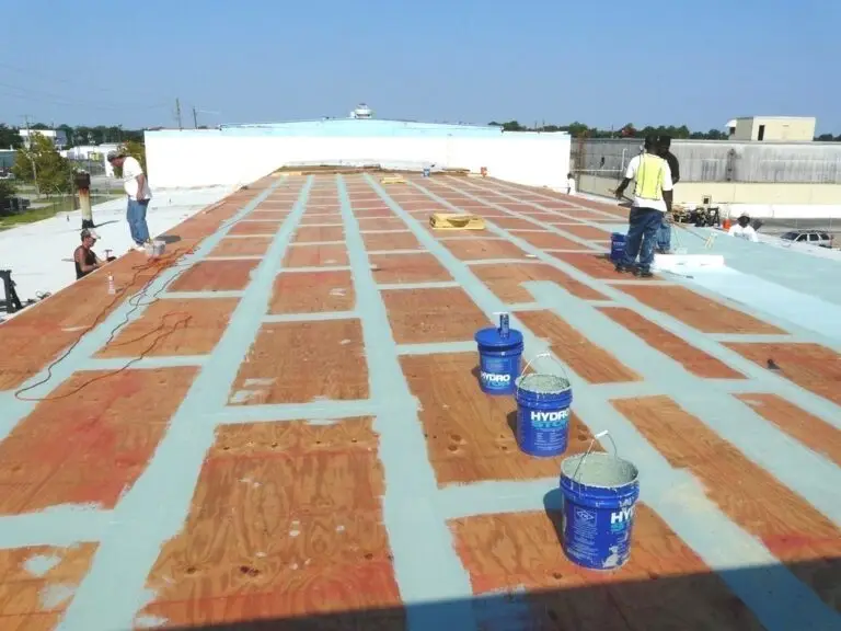 Commercial roof coating in Mobile, AL – seams and fasteners treated before the base coat