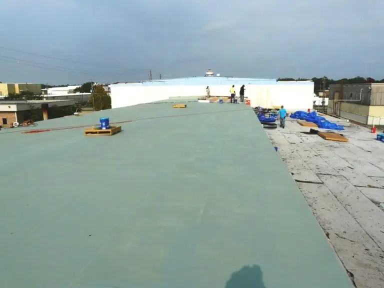 Commercial roof coating in Mobile, AL – base coat applied across the commercial roof