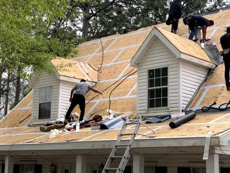 Roof replacement in Daphne, AL – ARC Roofing crew working around the dormers