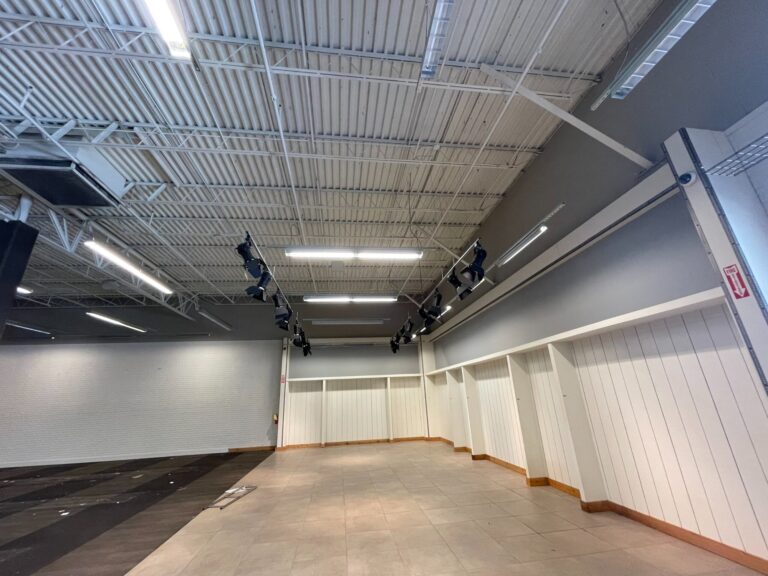 Commercial demolition in Mobile, AL: before – store interior and wall displays