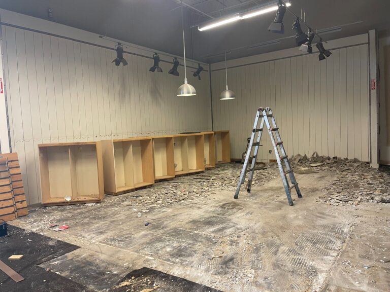 Commercial demolition in Mobile, AL: removing shelving and wall fixtures