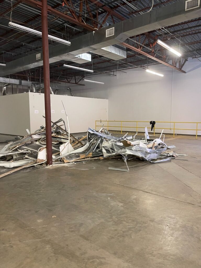 Commercial demolition in Mobile, AL: demolition debris gathered for removal