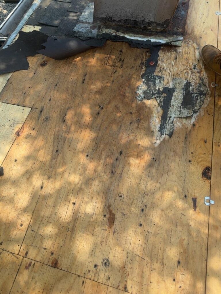 Roof replacement in Mobile, AL: tear-off – rotted decking found around a roof vent