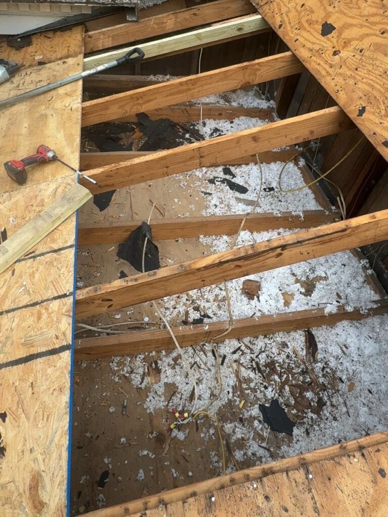 Roof replacement in Mobile, AL: tear-off – damaged decking removed down to the rafters