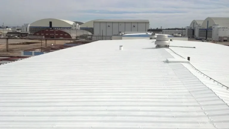 Finished white reflective coating on a commercial metal roof
