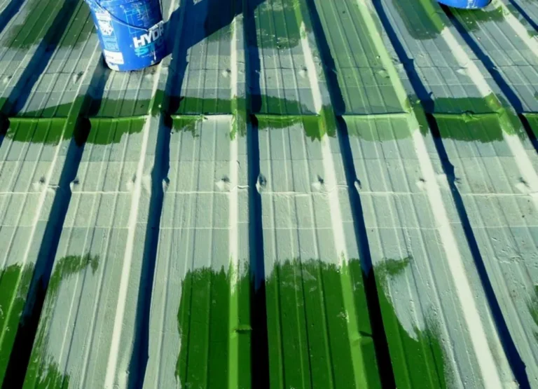 Horizontal metal roof seams reinforced with fabric and base coat